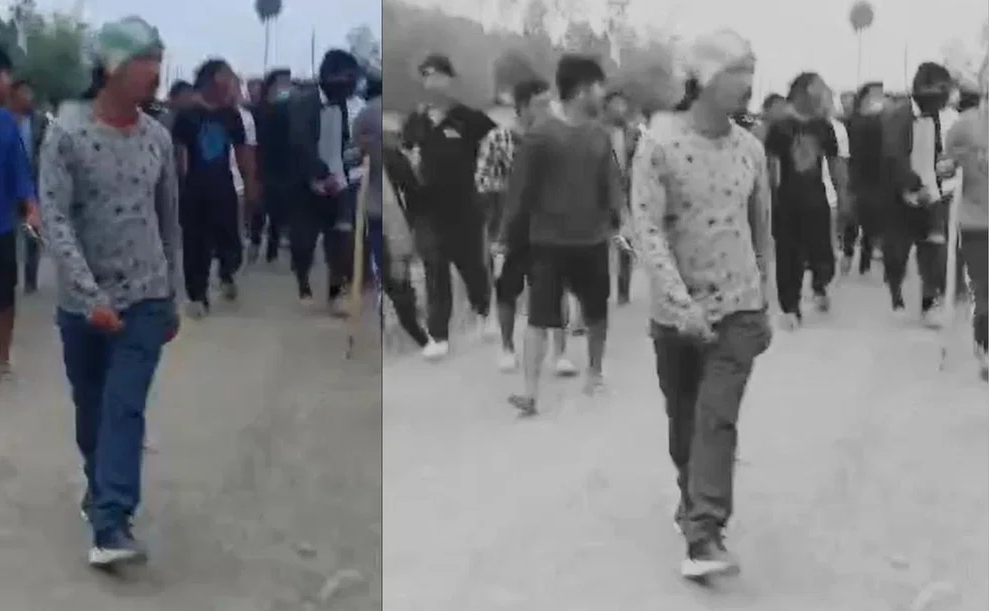 two tribal women being paraded naked on a road by a group of Men (Meiteis) in Manipur